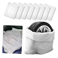 White LDPE tire storage bag set, folded and stacked for easy protection