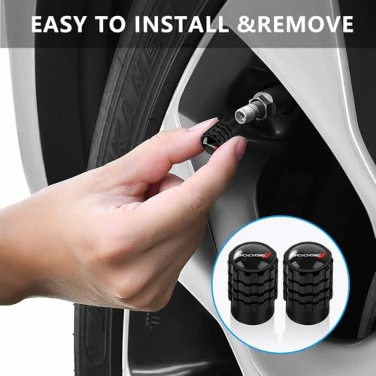 Hand installing black tire valve stem caps on a wheel valve stem, two caps shown