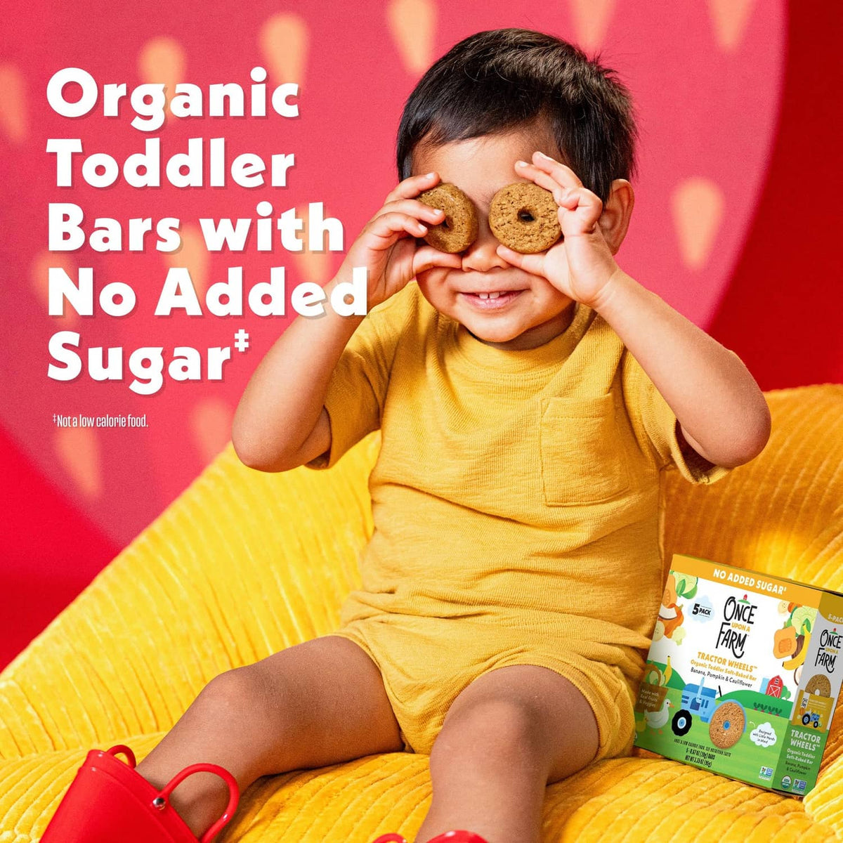 Toddler organic banana soft baked bars, no added sugar, shown with child holding wheel.