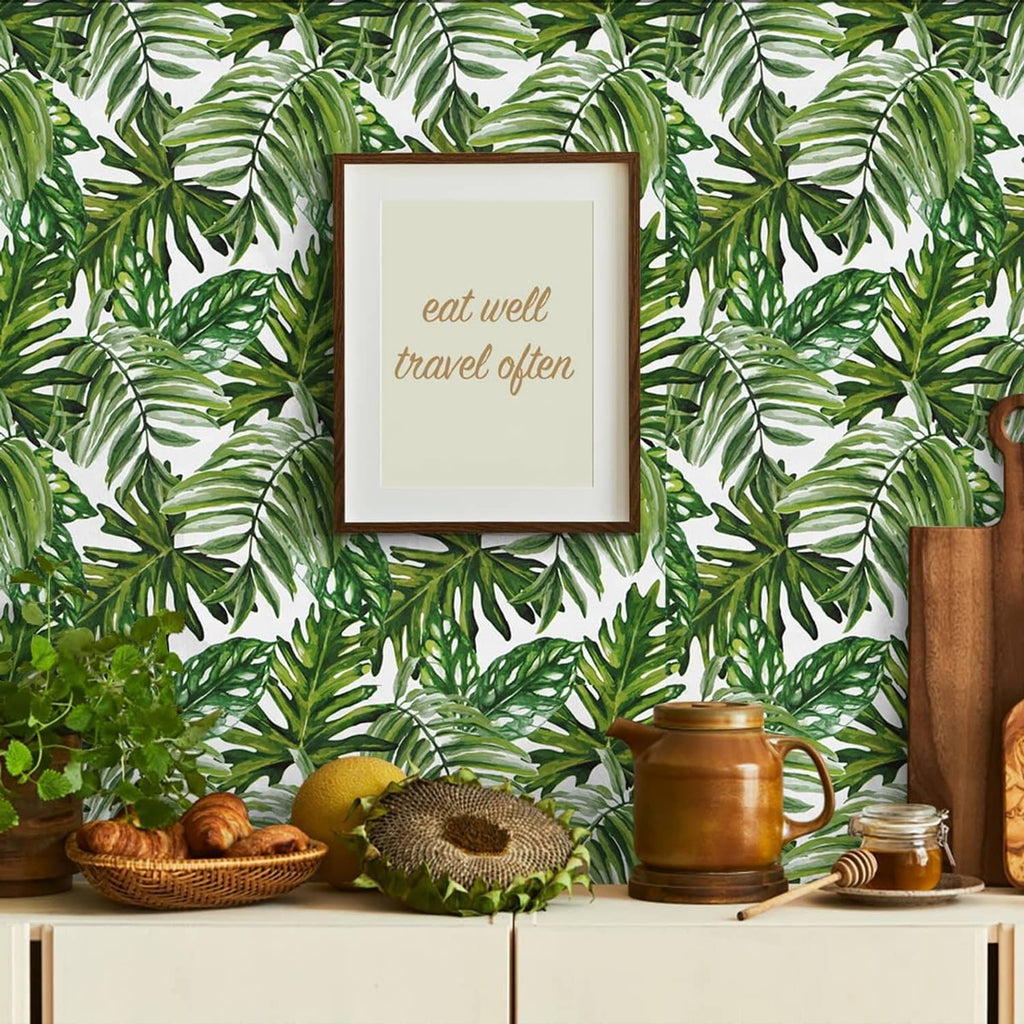 Tropical palm leaf wallpaper with green leaves on a white background, allover repeat