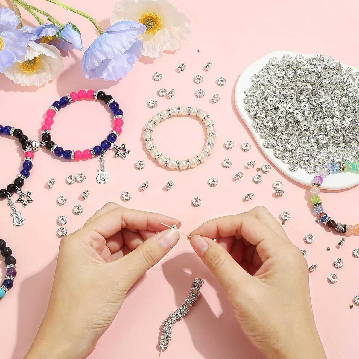 Rhinestone rondelle spacer beads scattered with beaded bracelets and charms