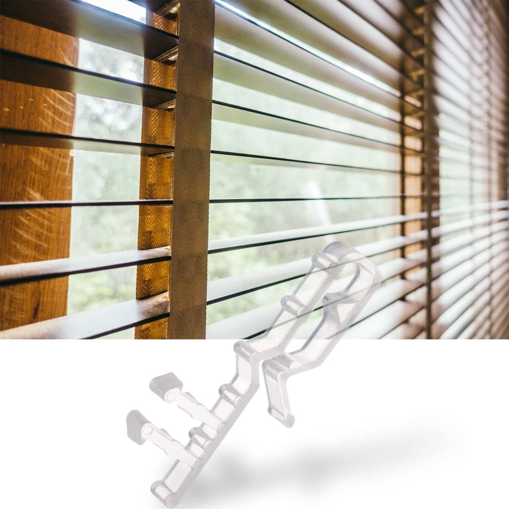 Clear plastic valance clips for window blinds, shown near the slats