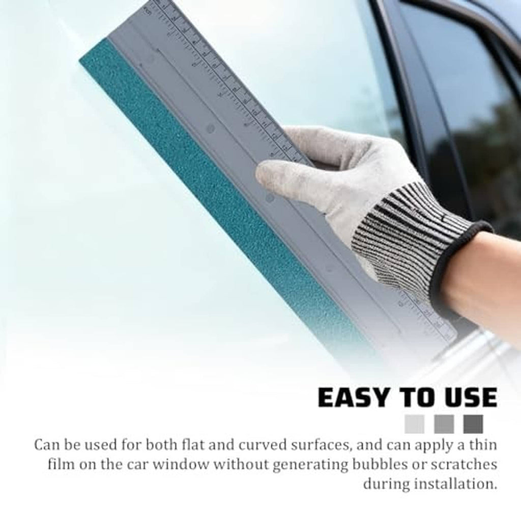 Car window felt squeegee with blue felt strip and gray ruler held by gloved hand