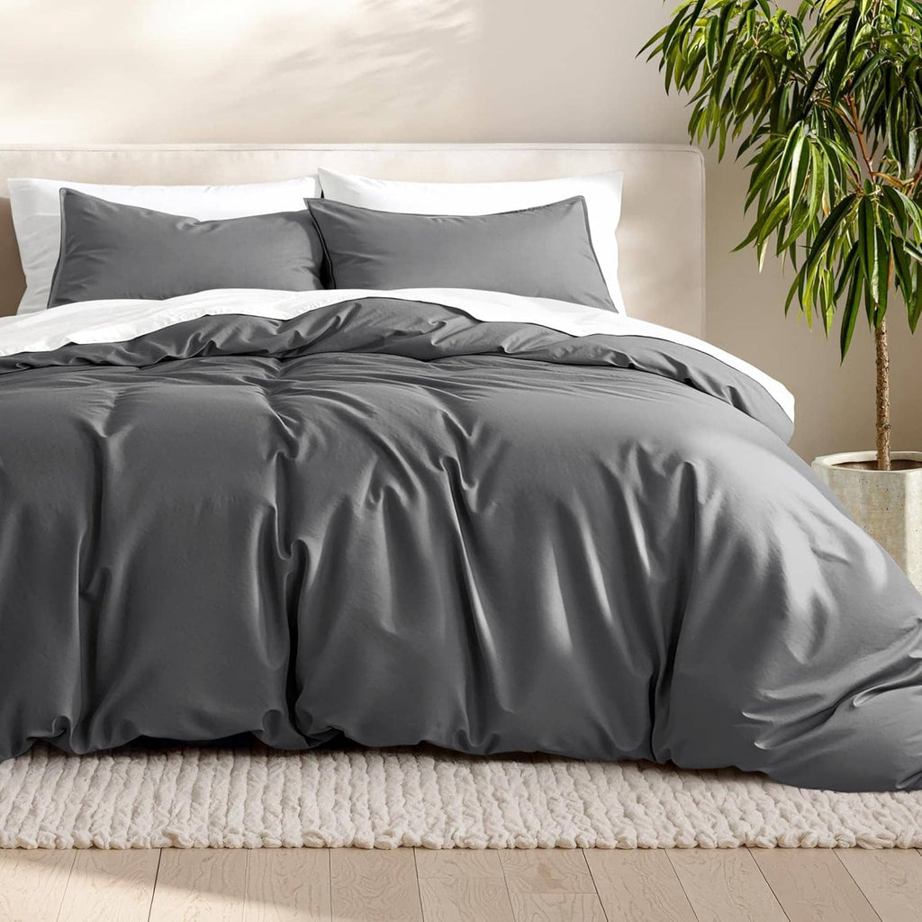 Queen duvet cover set in dark gray, pillow shams included with smooth folds.