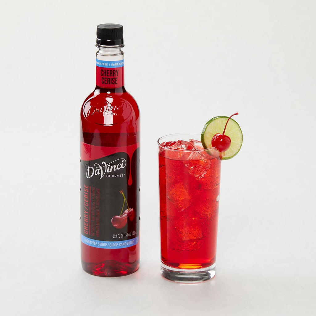 Sugar-free cherry syrup bottle and red cherry cocktail in a clear glass