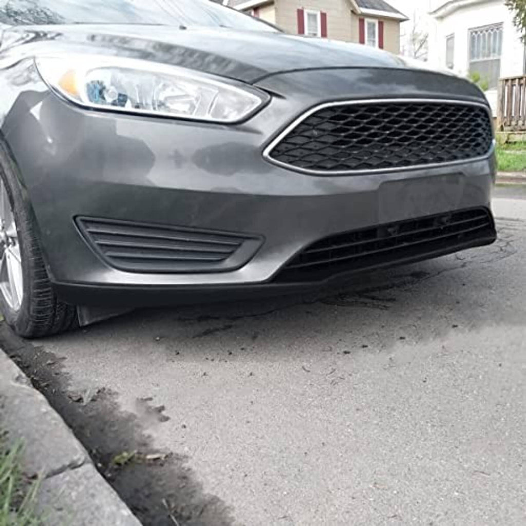 Front bumper lower grille on a vehicle, black mesh center and side vent openings