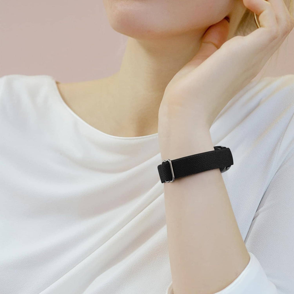 Black smartwatch band worn on wrist with secure band buckle