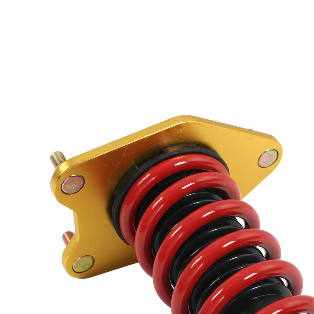 Close view coilover strut with gold bracket and red/black spring coils