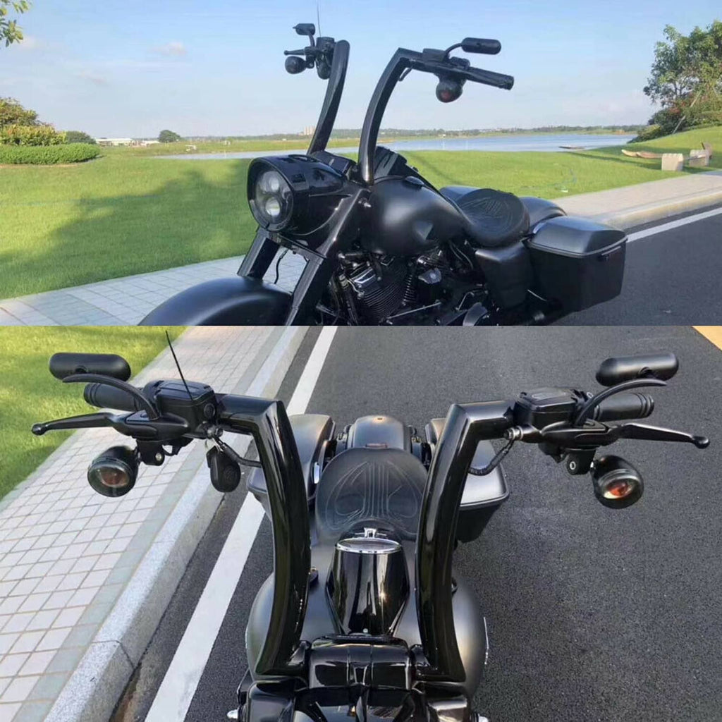Black ape hanger handlebars with controls on motorcycle in outdoor setting