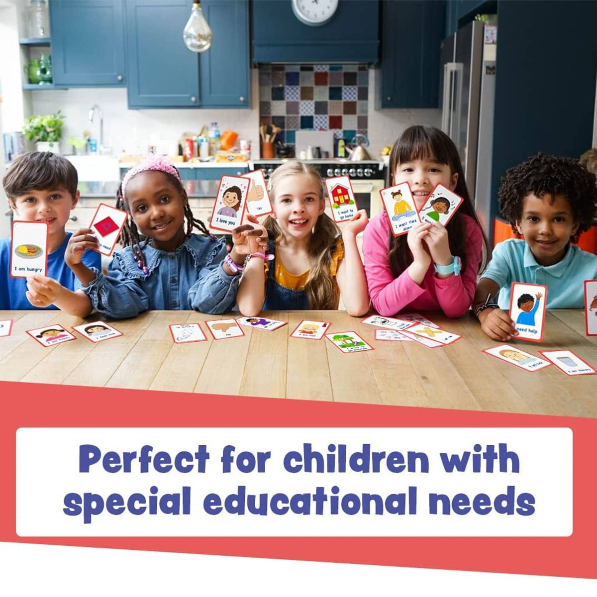 Child holding red-framed communication cards from the set during a learning activity