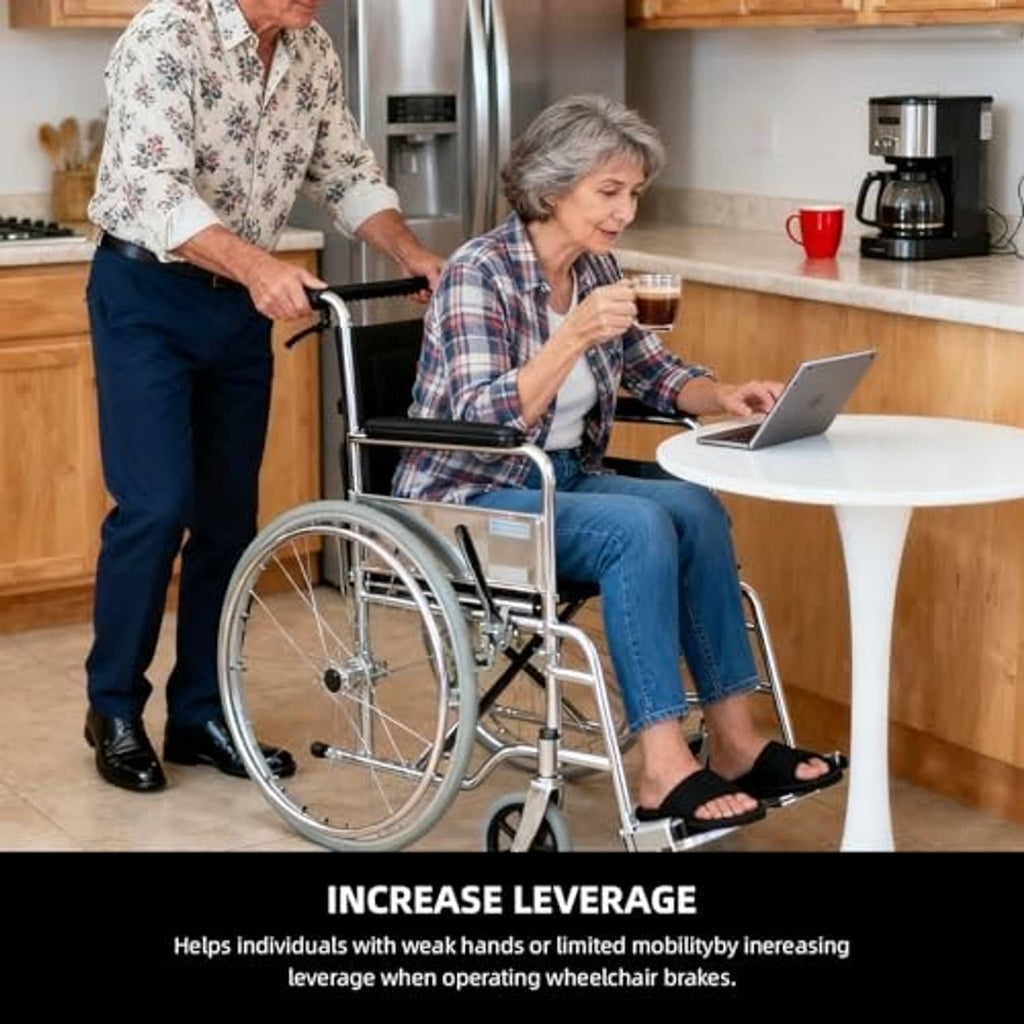 Wheelchair with black brake handle extenders used by seated person