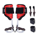 Red and black tree climbing spikes set with padded leg straps and steel prongs