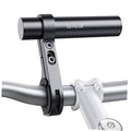 Black aluminum bike handlebar extender with clamp and end bar on gray handlebars