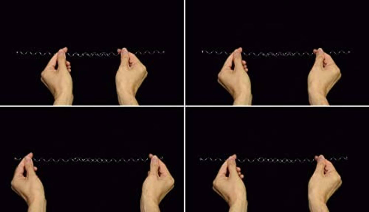 Coiled Wonder Wire stretched between fingers, showing flexible shape