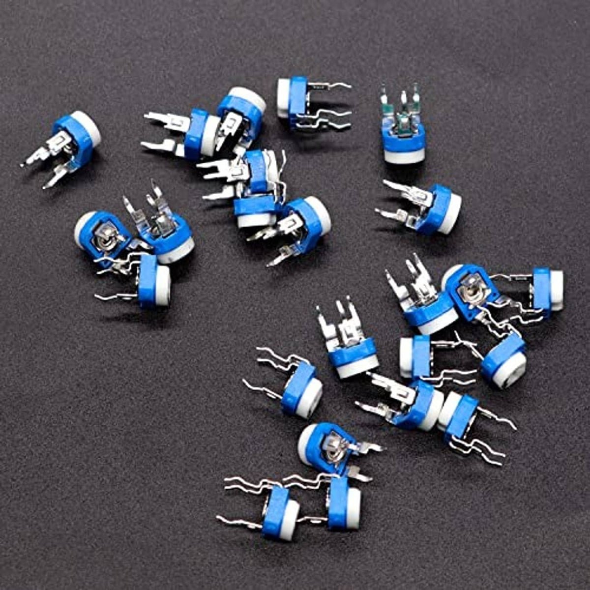 Assorted blue 6mm trimmer potentiometers with white caps and metal leads