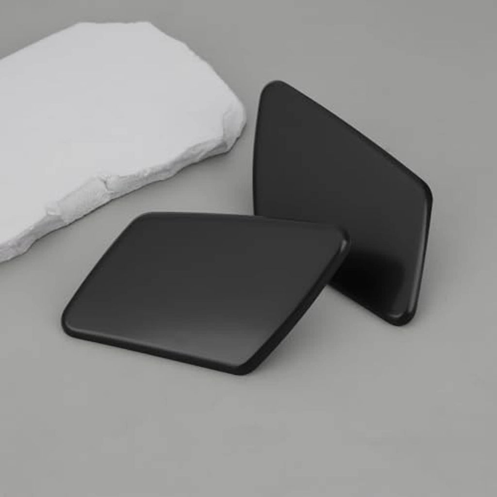 Front headlight washer nozzle cover caps, left and right, matte black plastic, side angle