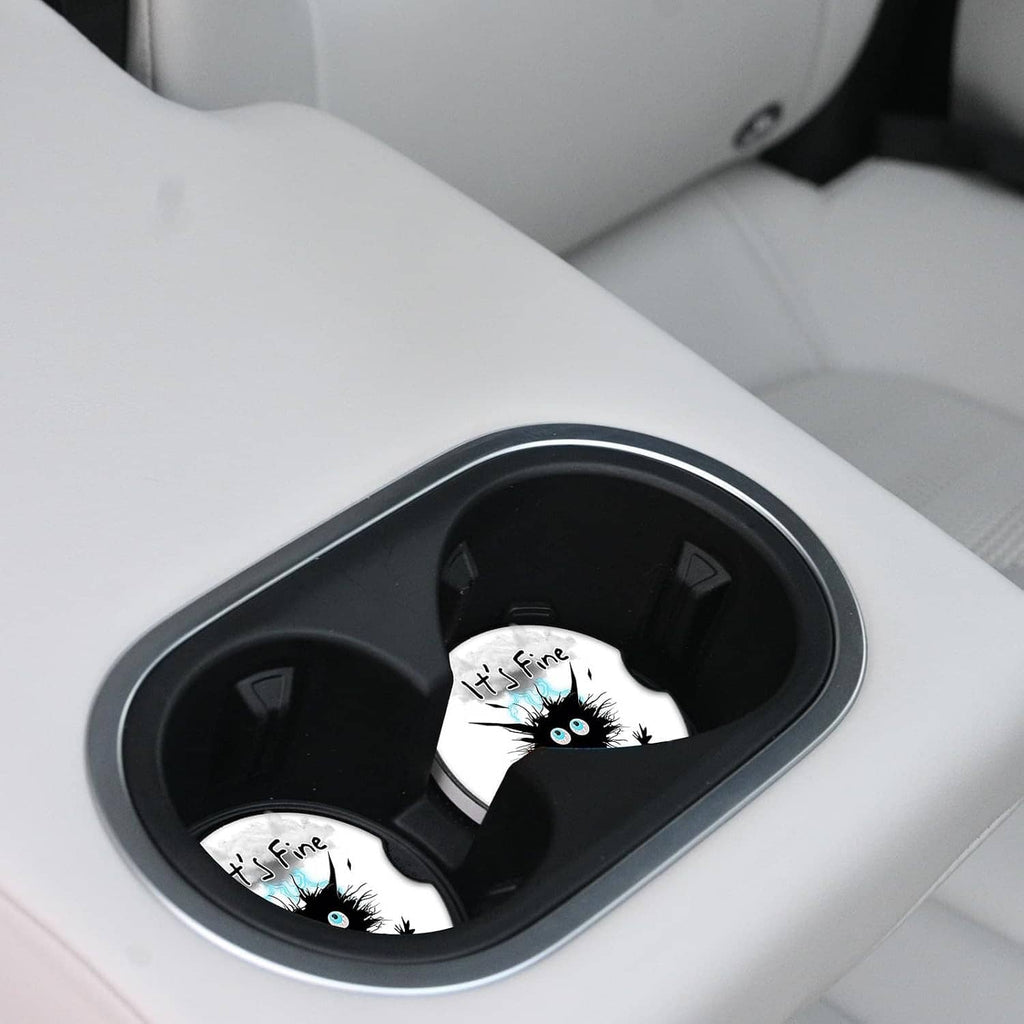 Black cat ceramic coaster pair in car cupholder with dark insert surrounds
