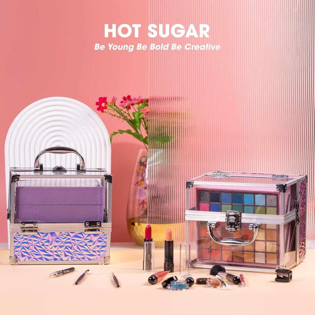 Pink makeup kit set with two cases, lip products, and palettes with brushes and tools.