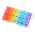 Clear weekly pill organizer with rainbow 7-day compartments and moon/sun day icons