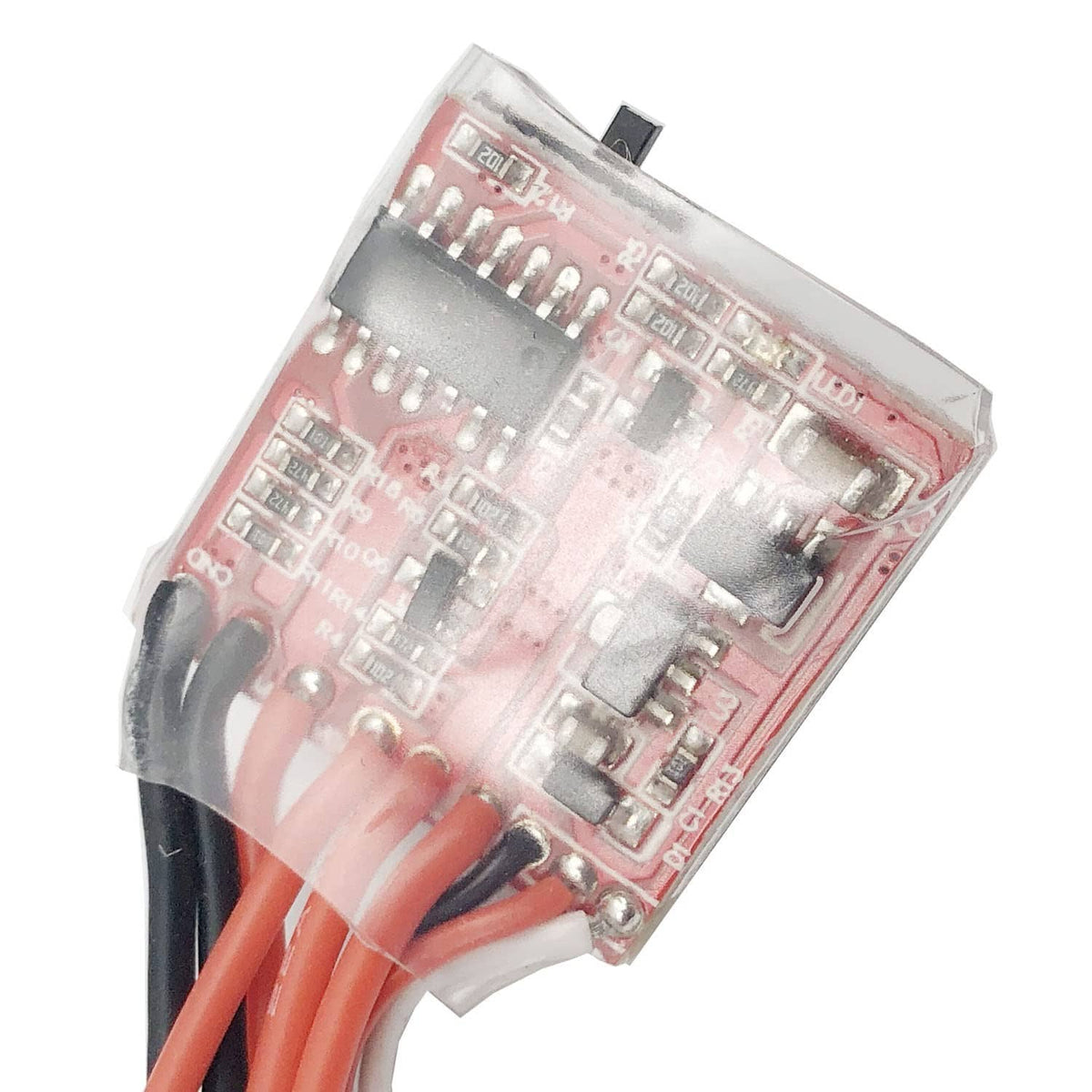 Brushed RC ESC circuit board with red wiring terminals and component chips