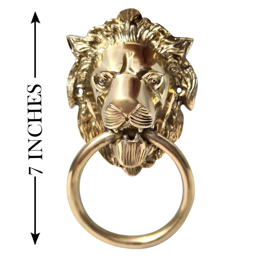 Gold-tone lion door knocker with circular ring handle and raised lion-head details