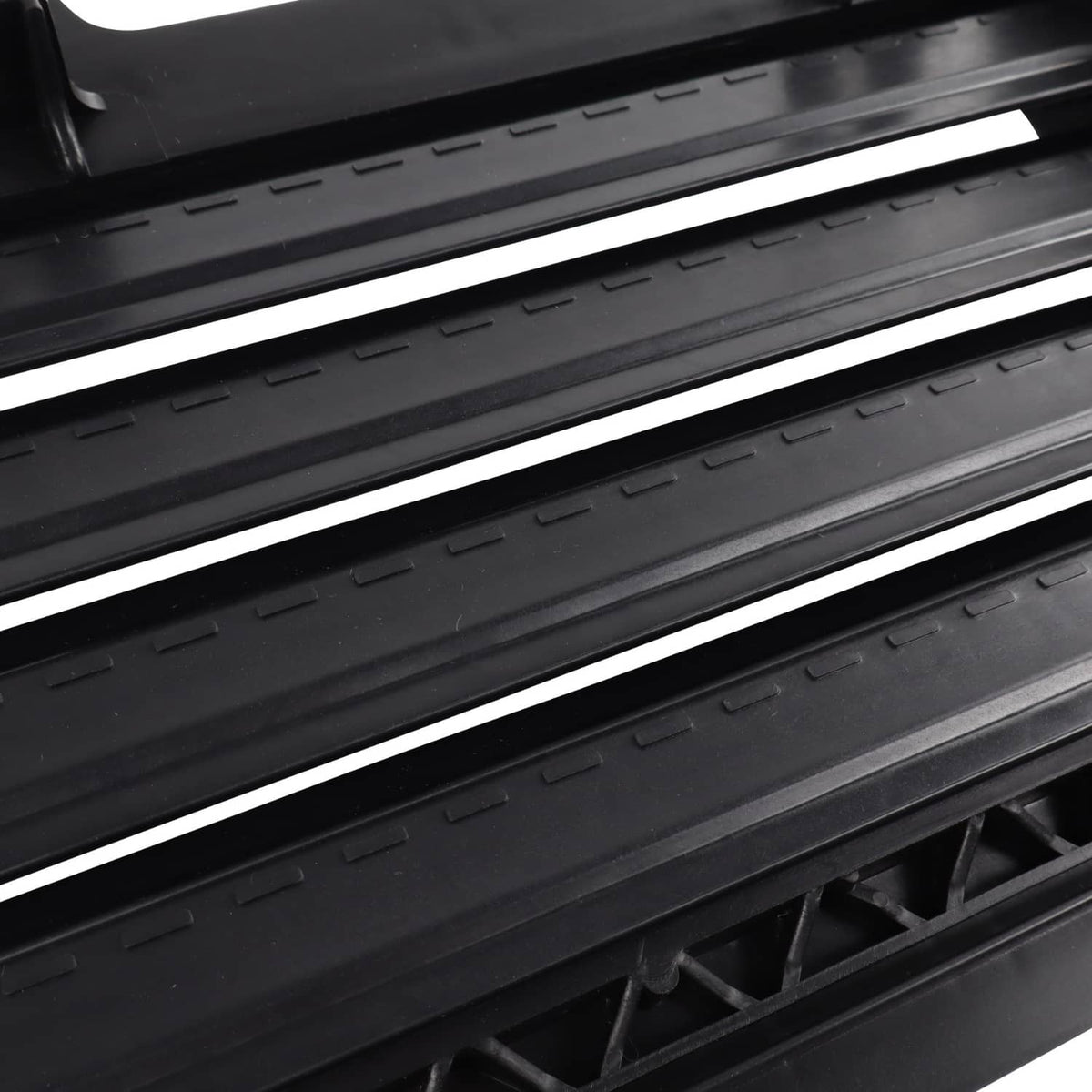 Black upper radiator grille air shutter vent with horizontal slats detail
