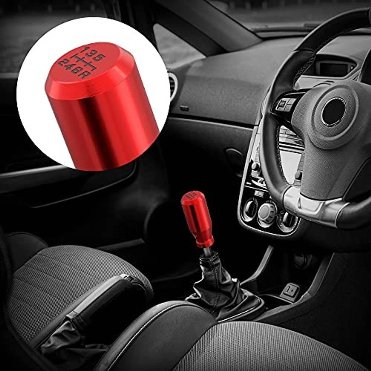 Red gear shift knob shown in car interior near the manual gear lever