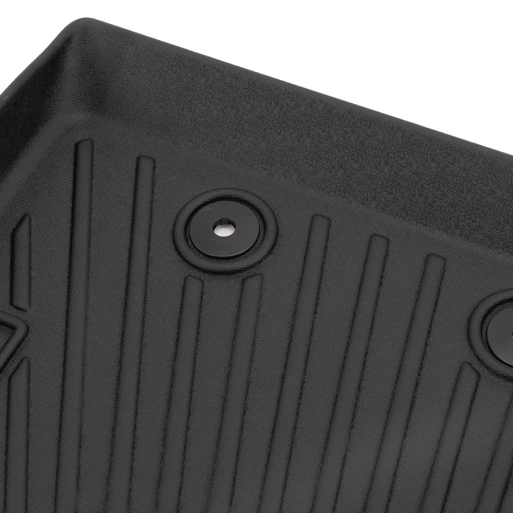 Black TPE floor mat with raised channels and round mounting hole