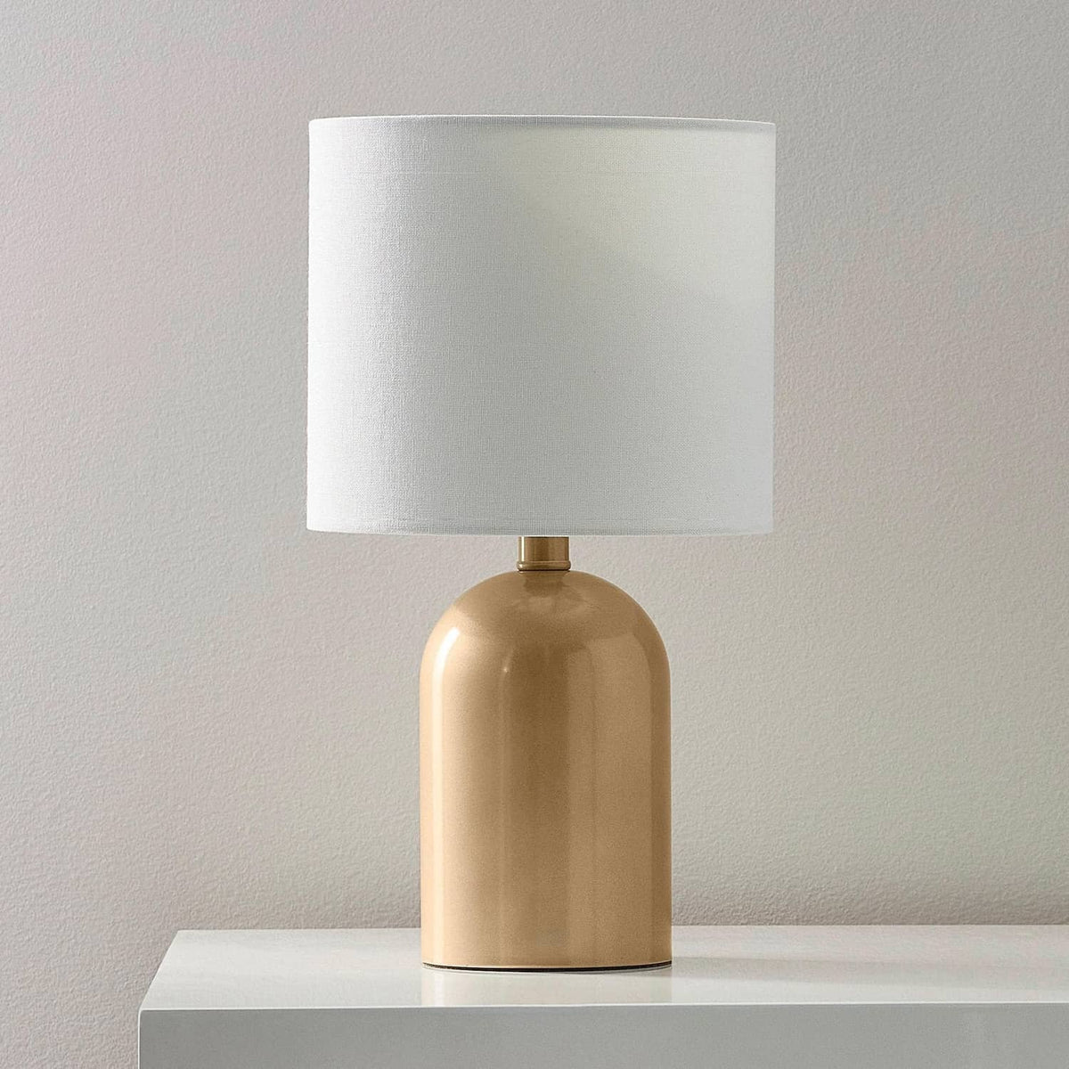 Champagne metallic table lamp base with white fabric shade