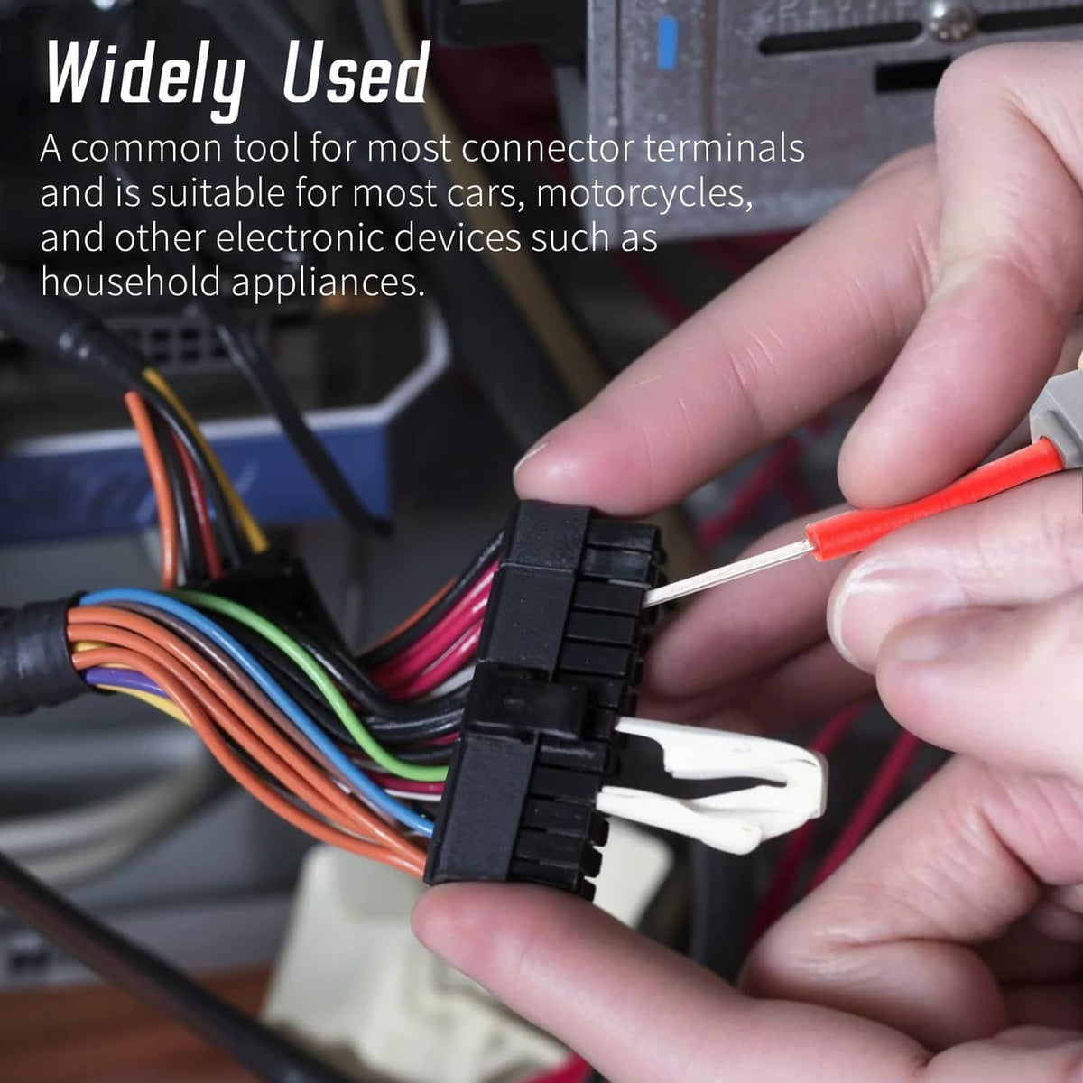 Using terminal removal tool to lift a connector terminal from a wiring plug