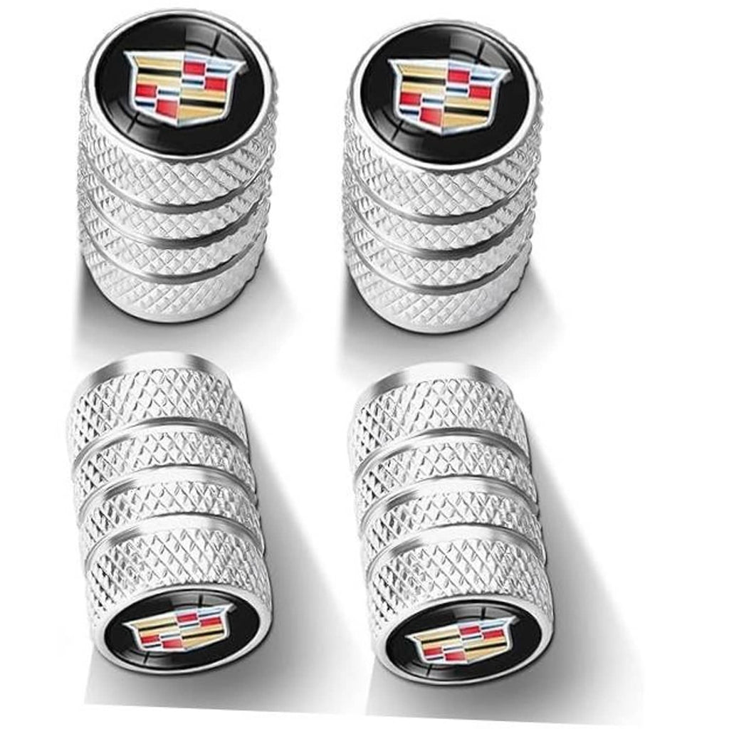 Silver textured tire valve stem covers with round black top and crest emblem
