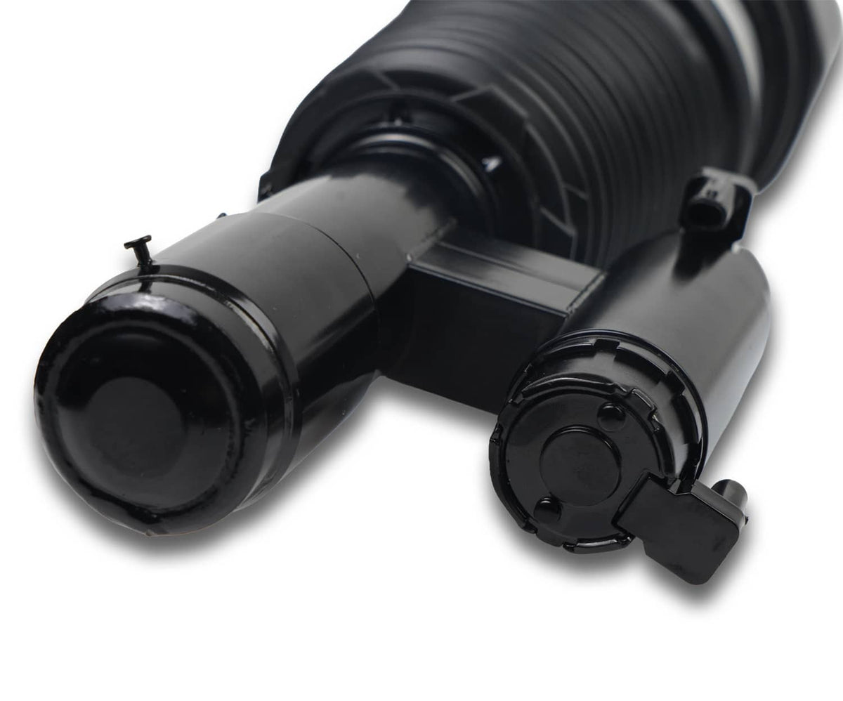 Close-up of front air suspension strut: black bellow housing and mounting bracket