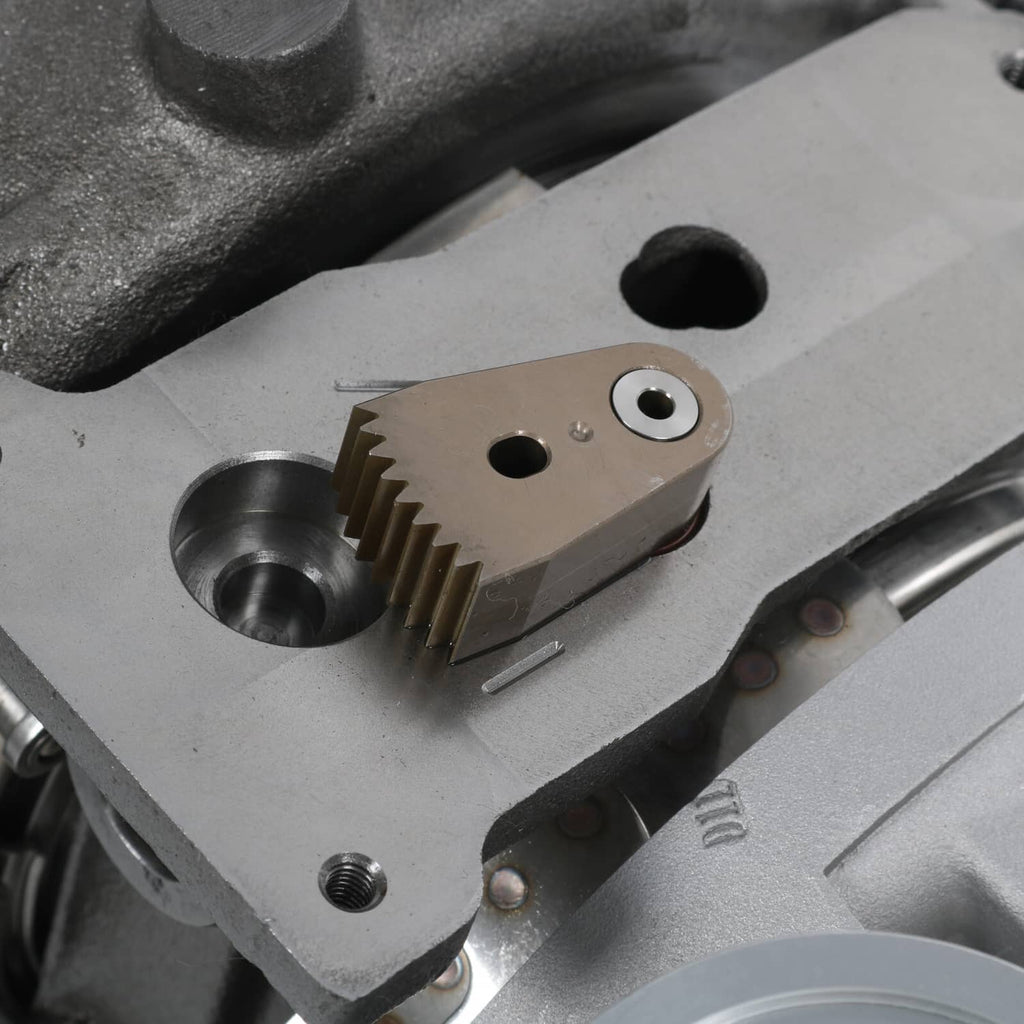 Turbocharger actuator and gear linkage close-up on the housing surface