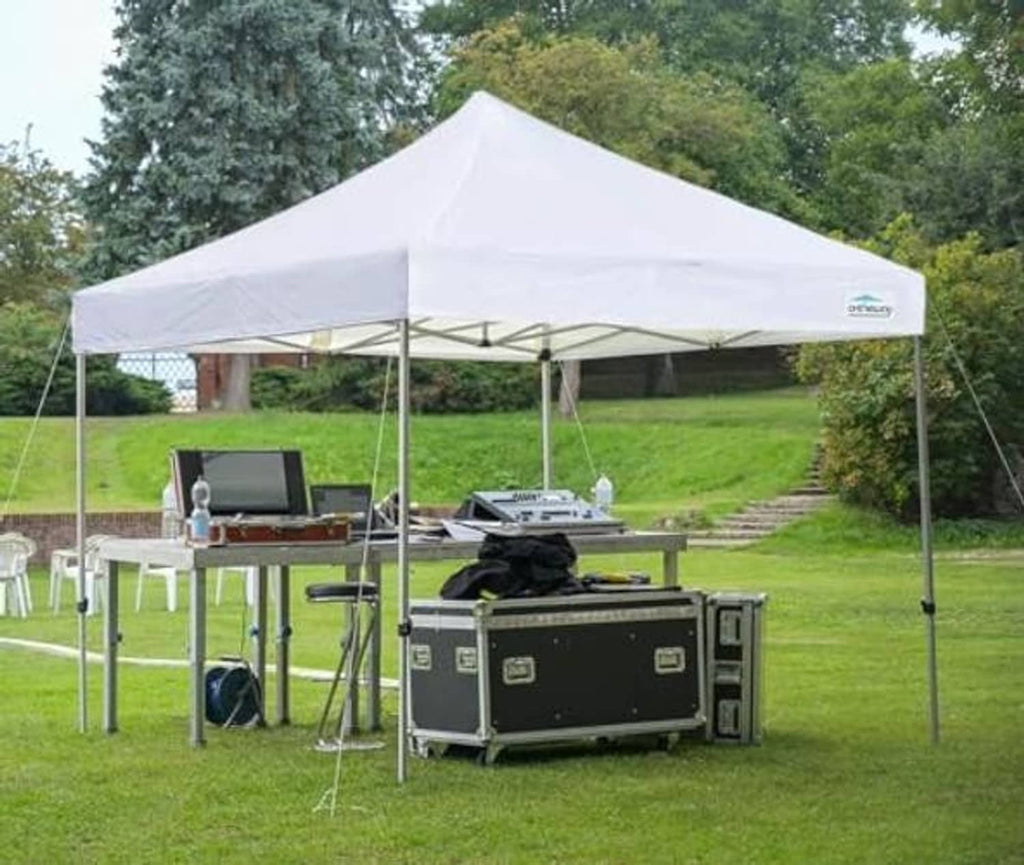 White pop-up tent canopy top mounted over a frame for outdoor events