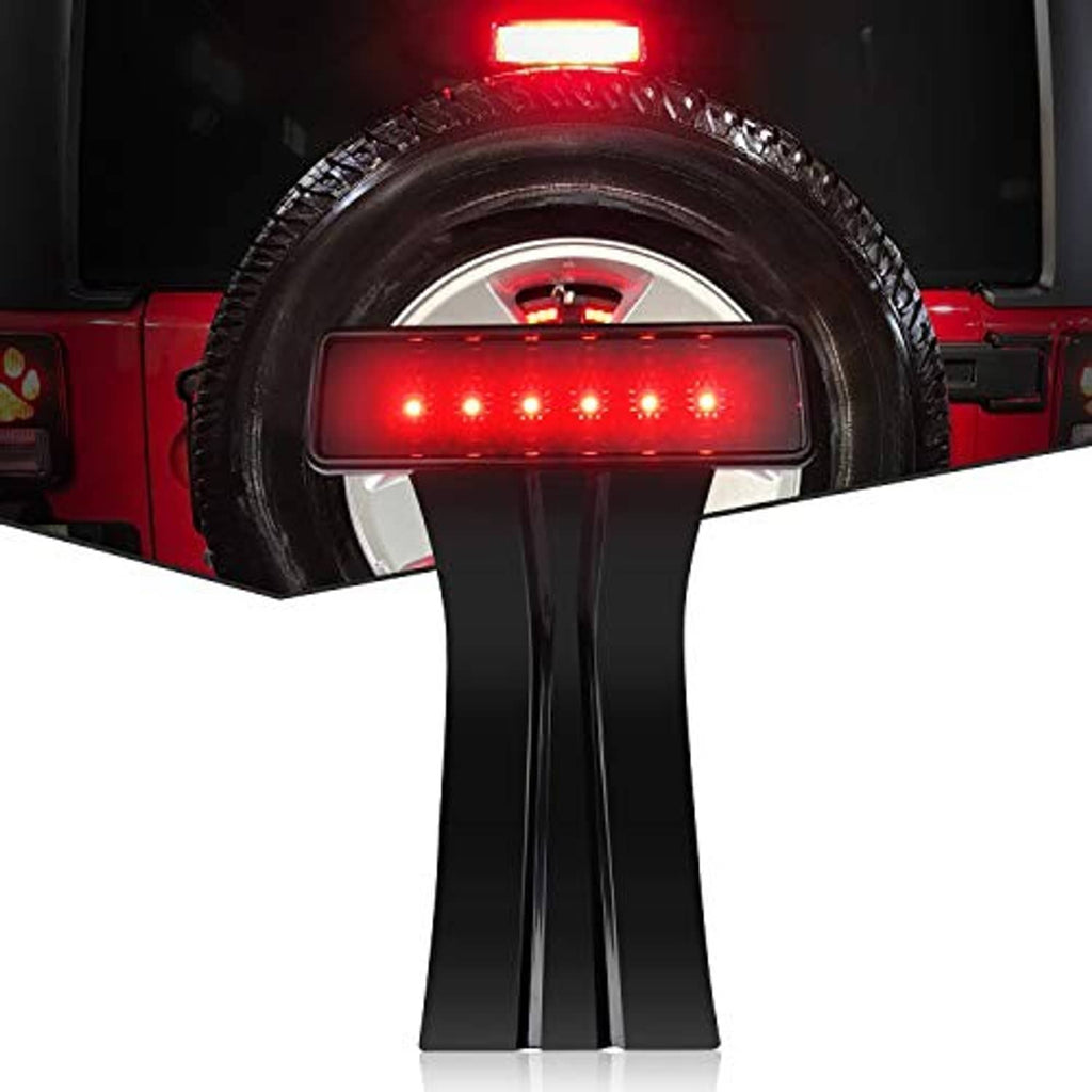 LED high-mount third brake light glowing red with black housing and mounting stand