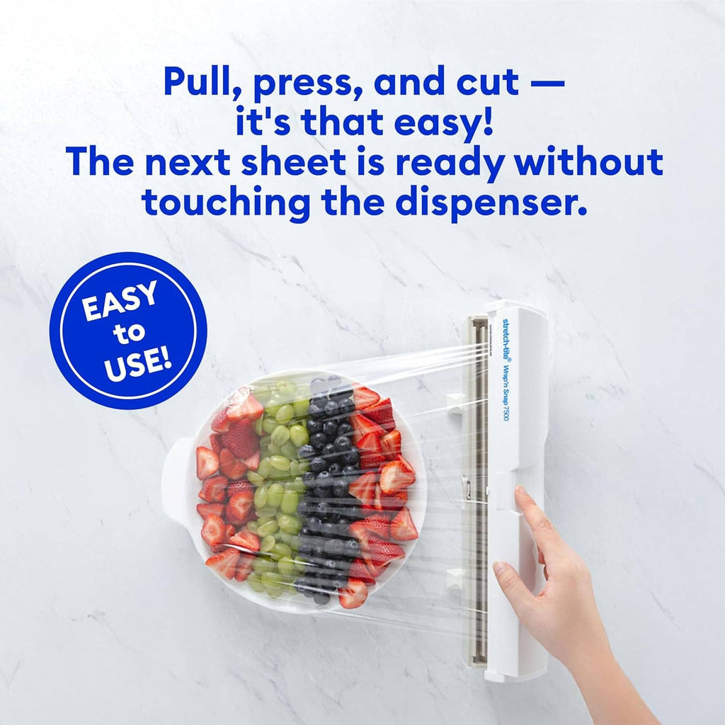 White plastic wrap dispenser with cutter, dispensing clear wrap onto food on plate