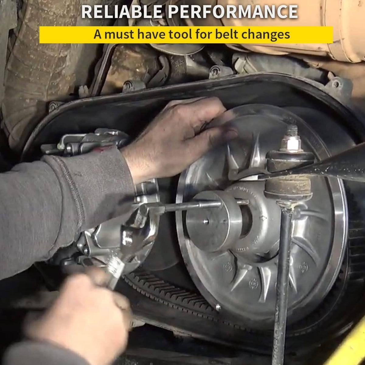 Clutch puller tool in use with threaded rod and plate against engine components