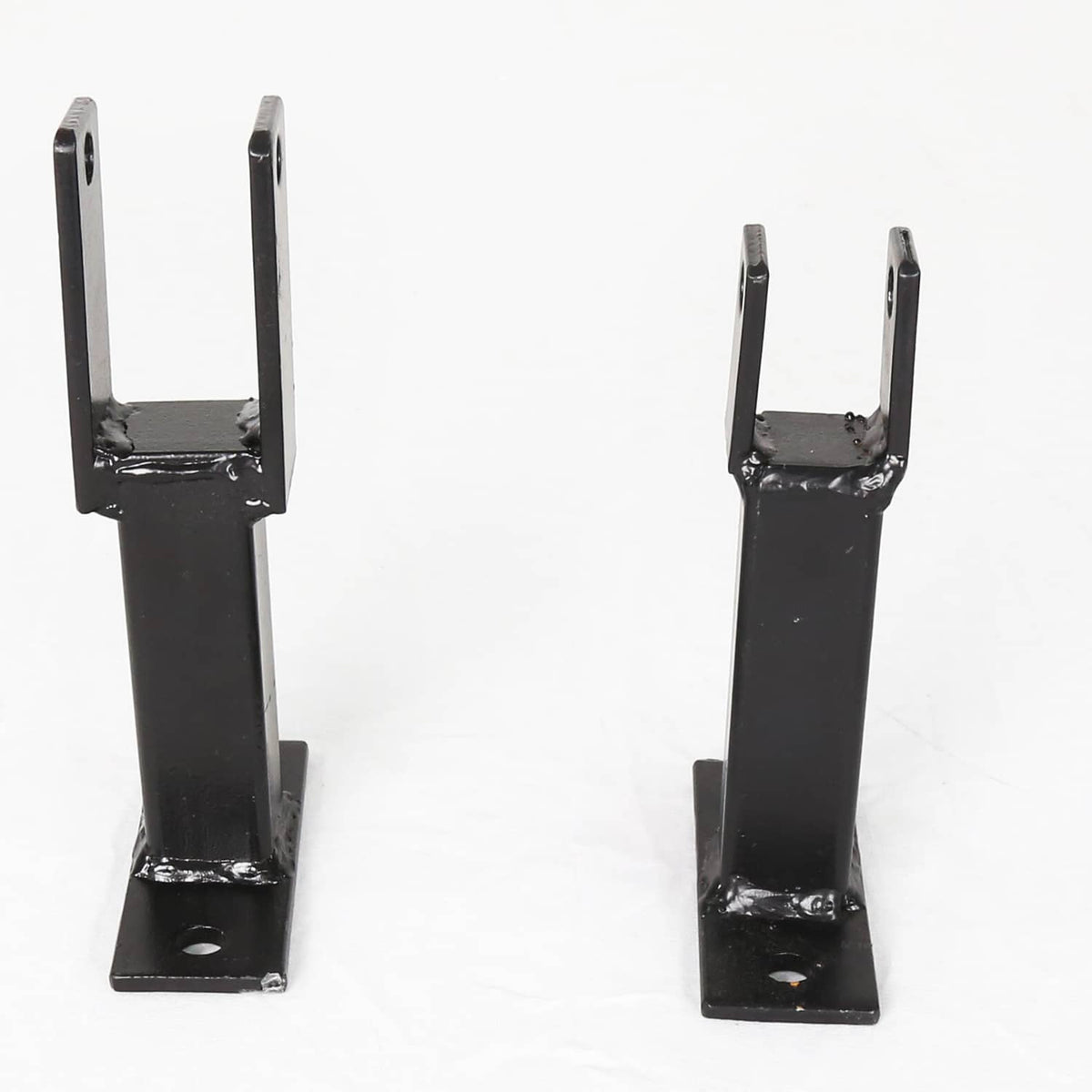 Two black powder-coated steel rack holder brackets on flat base plates with mounting holes