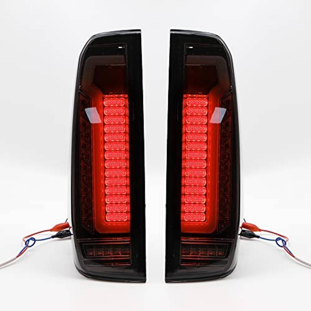 Pair of LED tail lights with red illuminated inner bars behind tinted outer lens, black housings