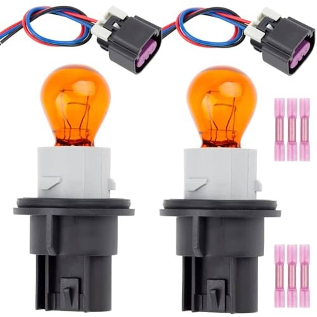 Two turn signal bulb sockets with wiring harness, orange bulbs, black 3-pin plugs
