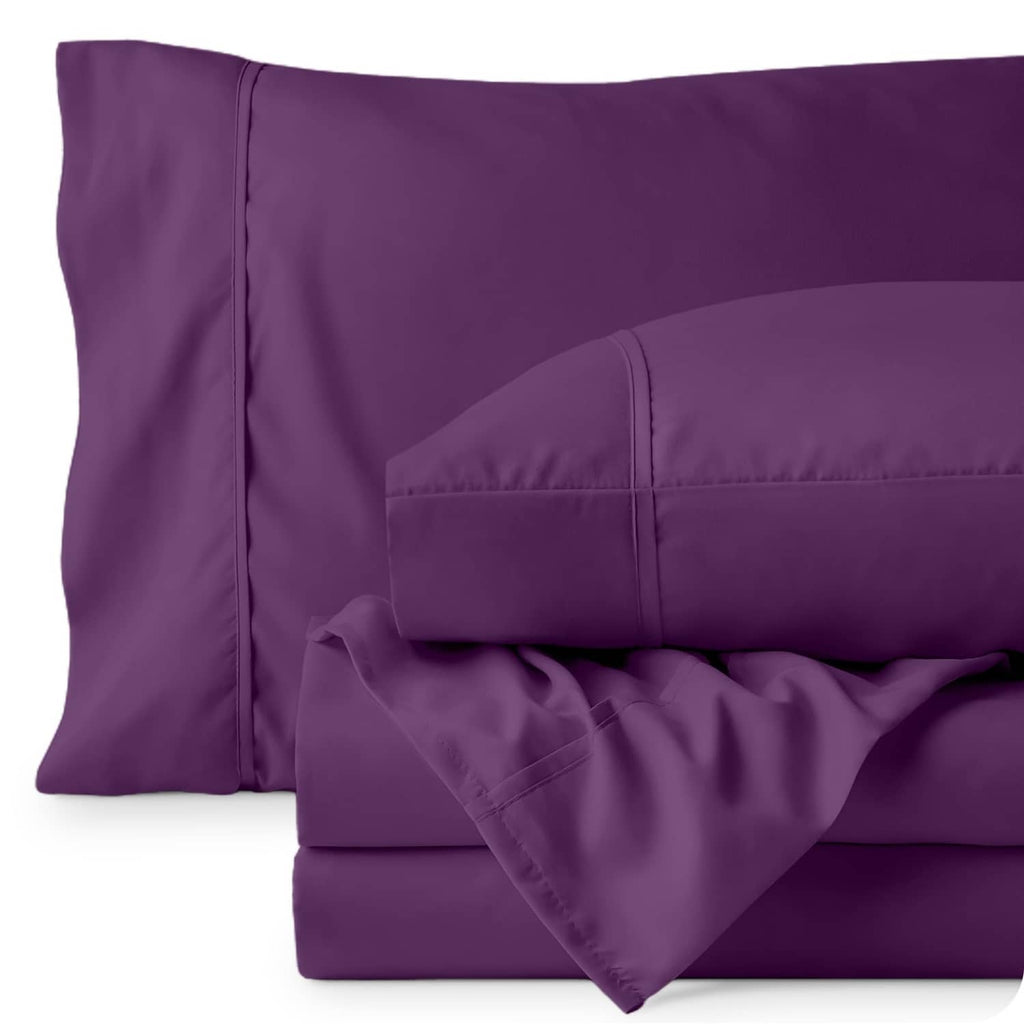 Plum pillowcase and folded flat sheet with visible stitched seams