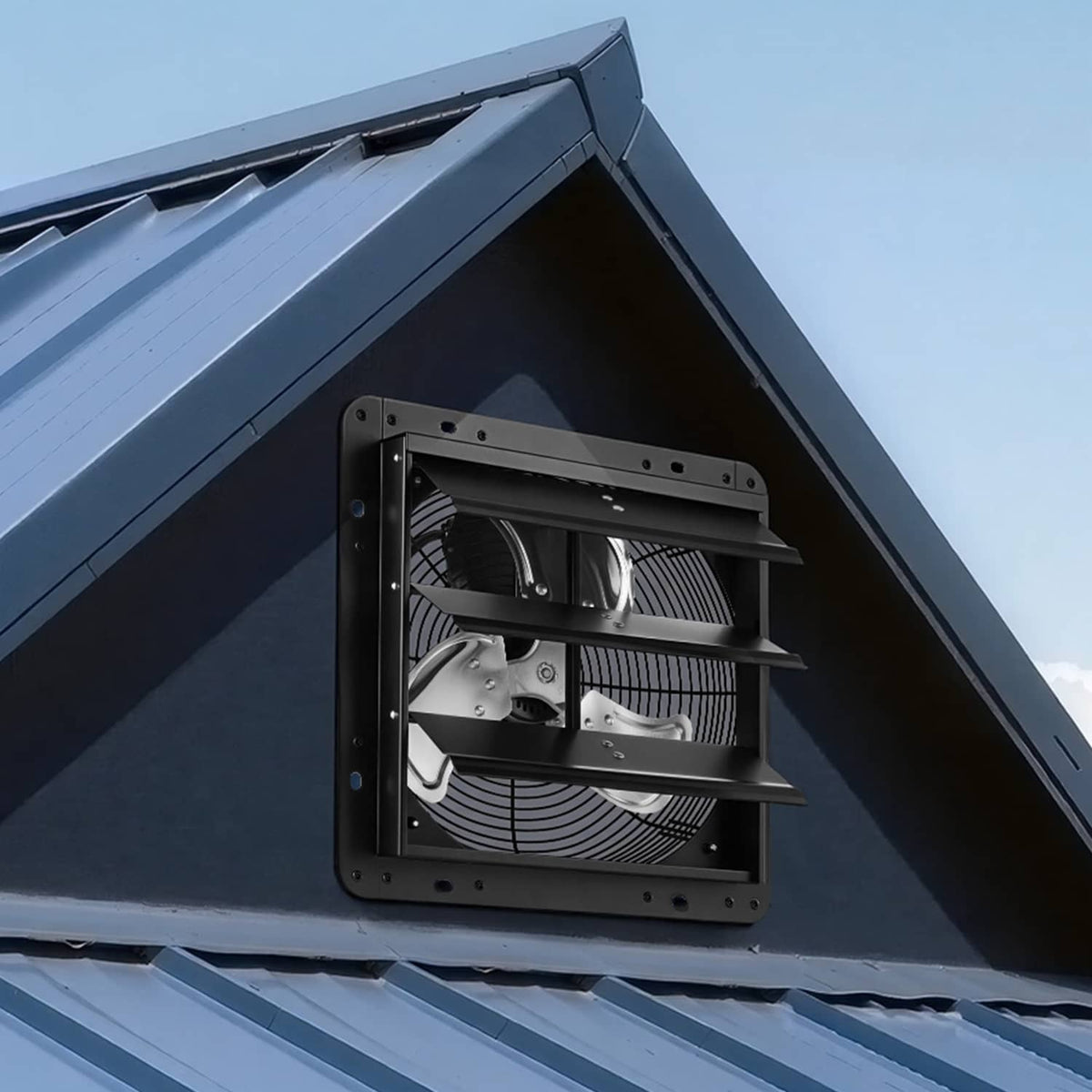 Wall-mount shutter exhaust fan mounted under a building roof edge