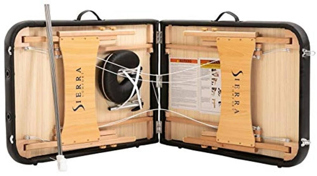Portable massage table in open black case with wood slats and securing straps