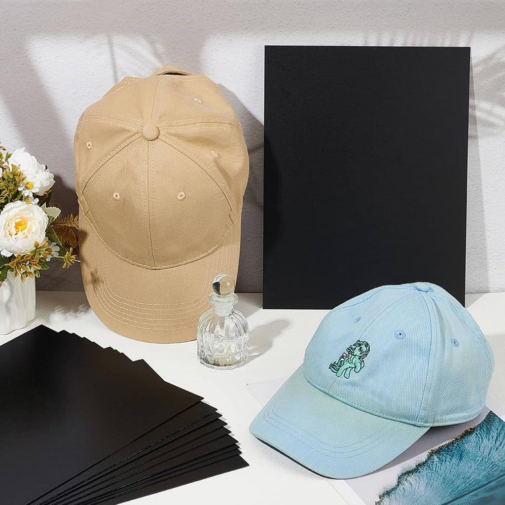 Black rectangular brim insert sheets beside light blue and beige caps
