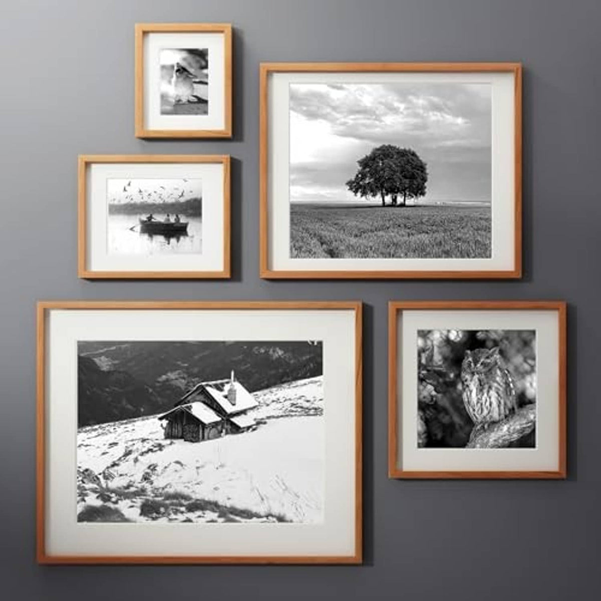 Set of natural wood picture frames with clear glass, displaying black-and-white photos