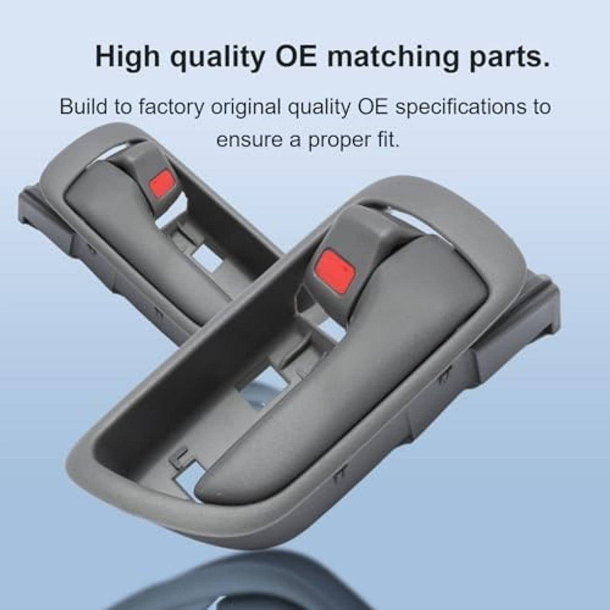 Pair of gray interior door handles with red switch, angled top view