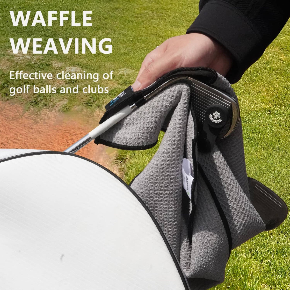 Waffle-weave black golf towel folded for cleaning club heads and balls