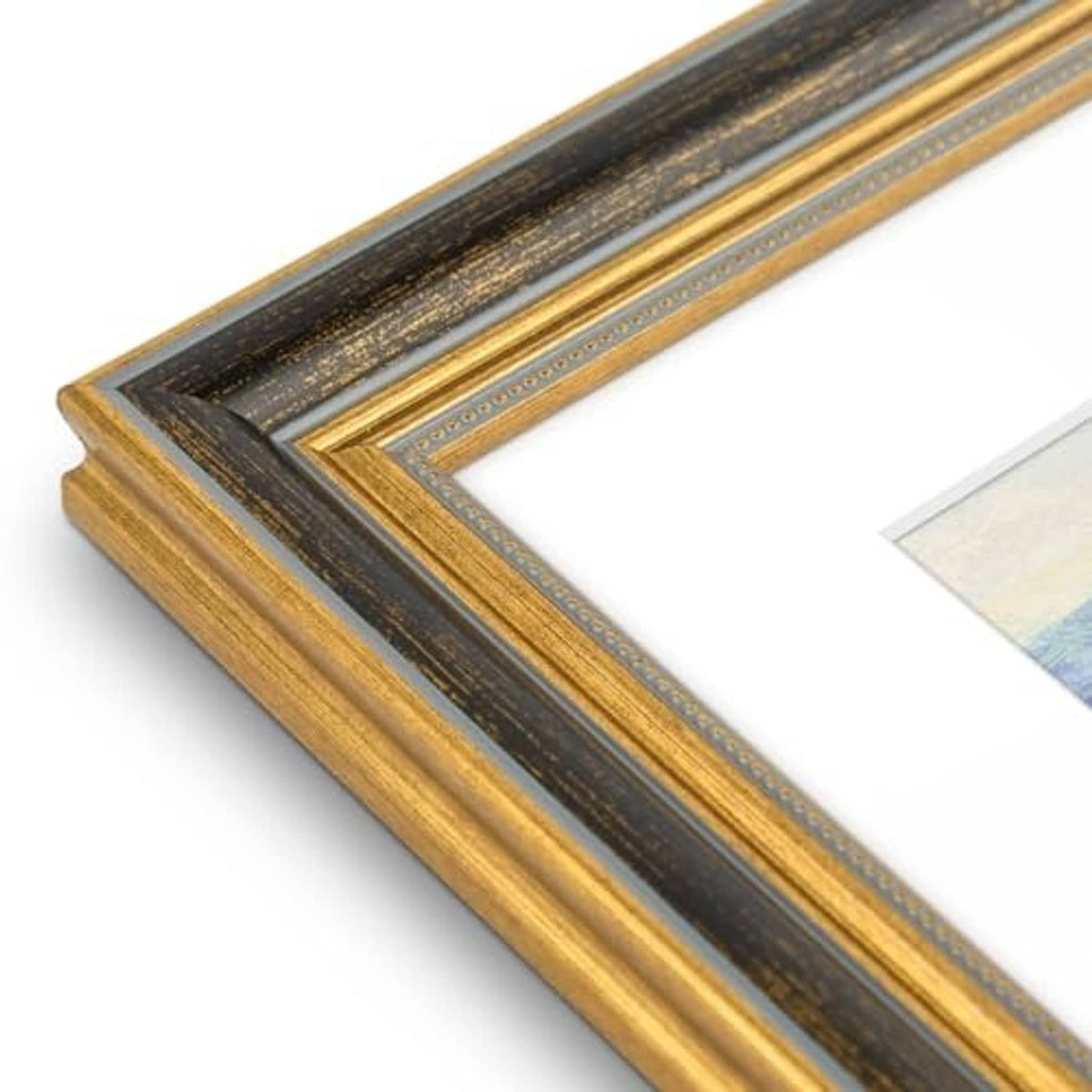 Black and gold ornate picture frame molding with ridged trim along the edge