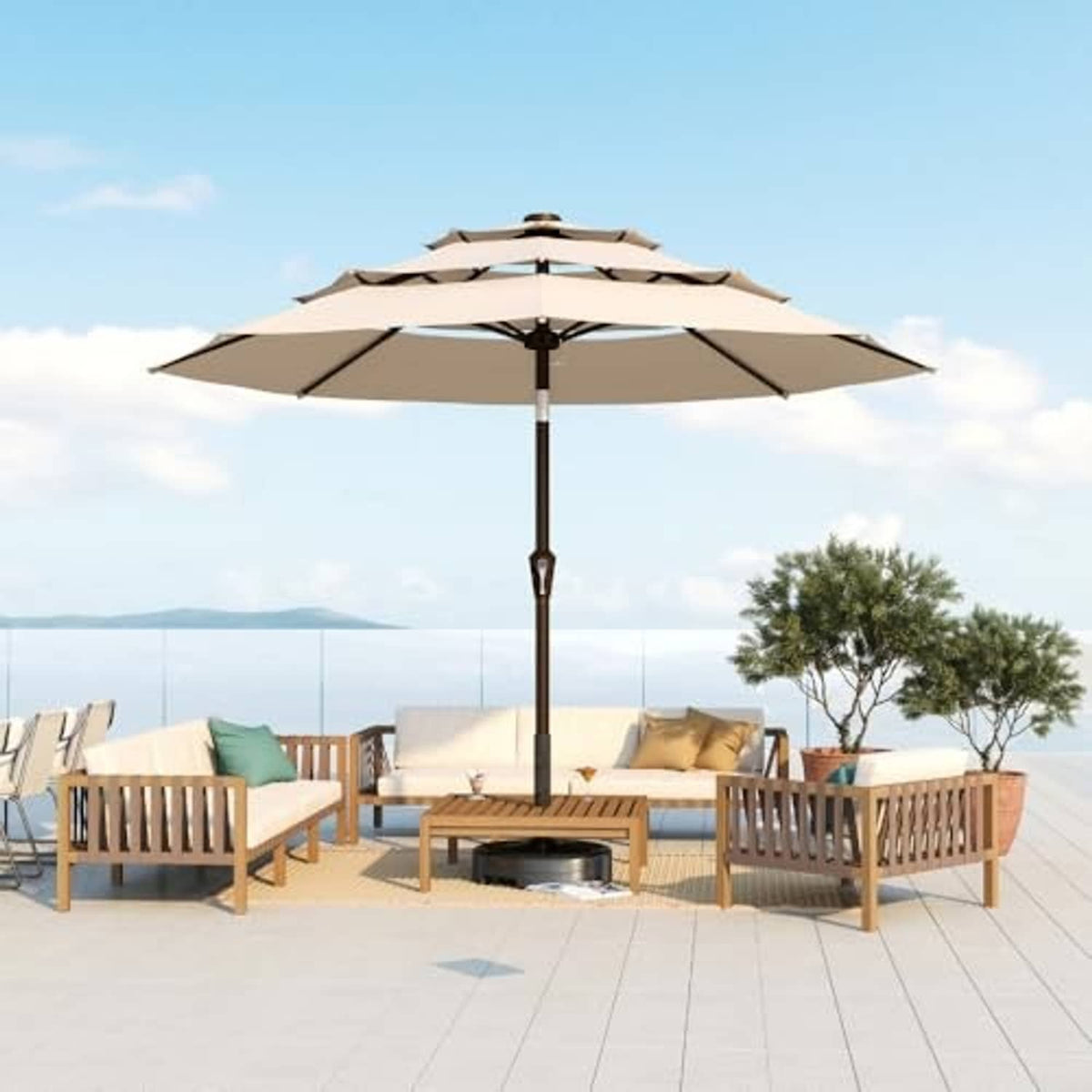 Beige 3-tier patio market umbrella on black center pole, open canopy