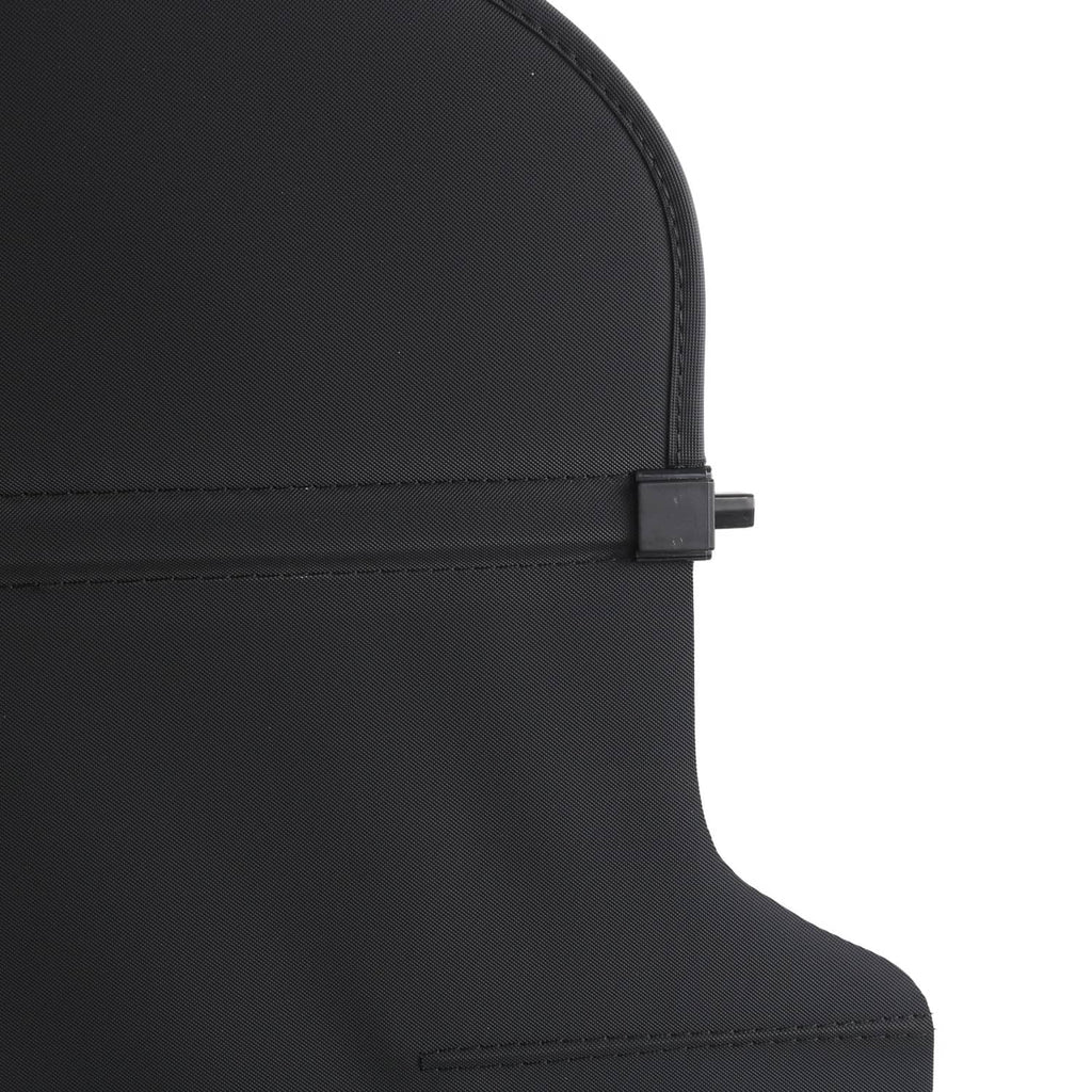 Black fabric cargo cover corner with stitched seam and small fastening tab.
